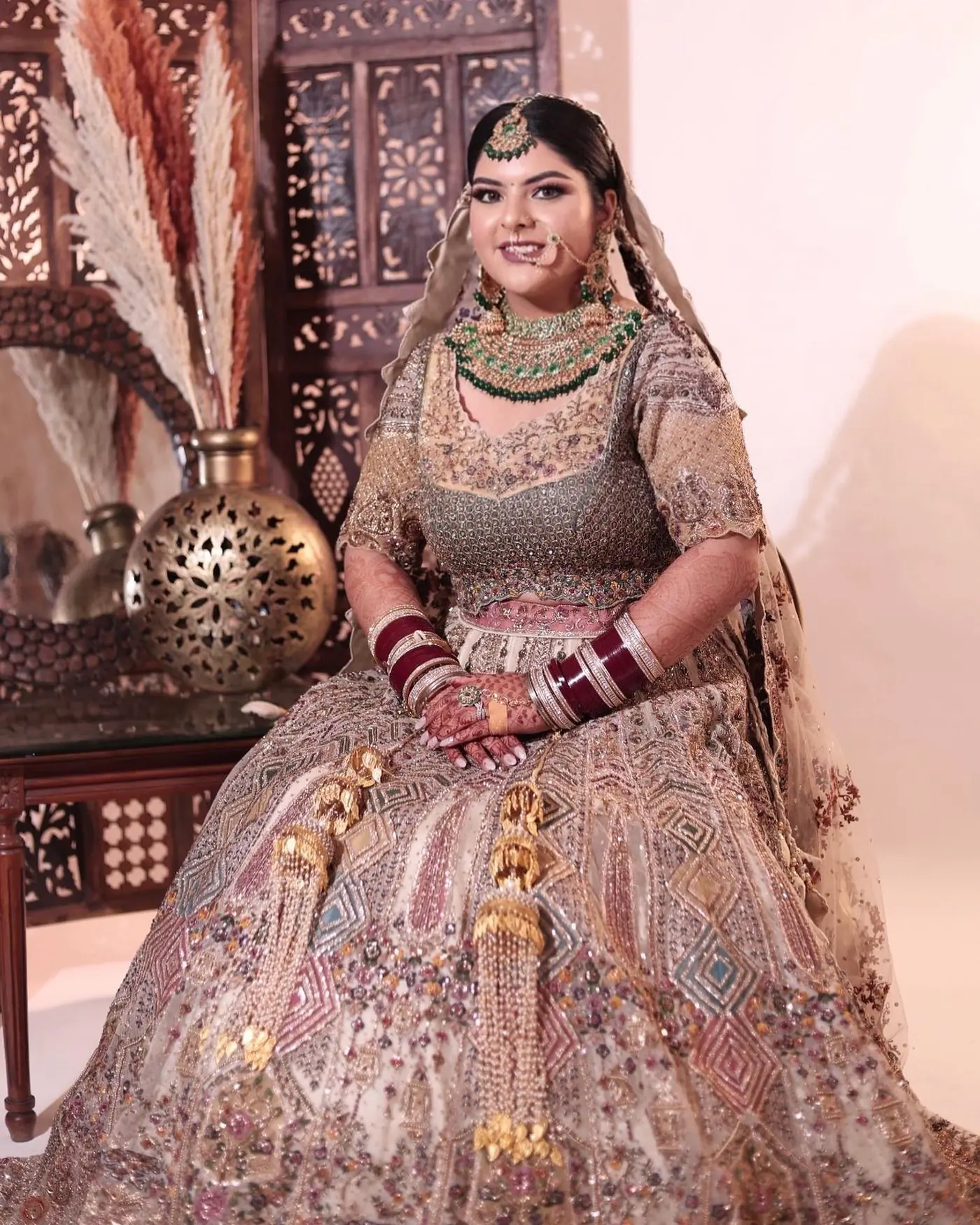 Champagne Lehenga, Ornate Chair. Bridal makeup by Madhu Gupta at MG Makeovers, Gurugram